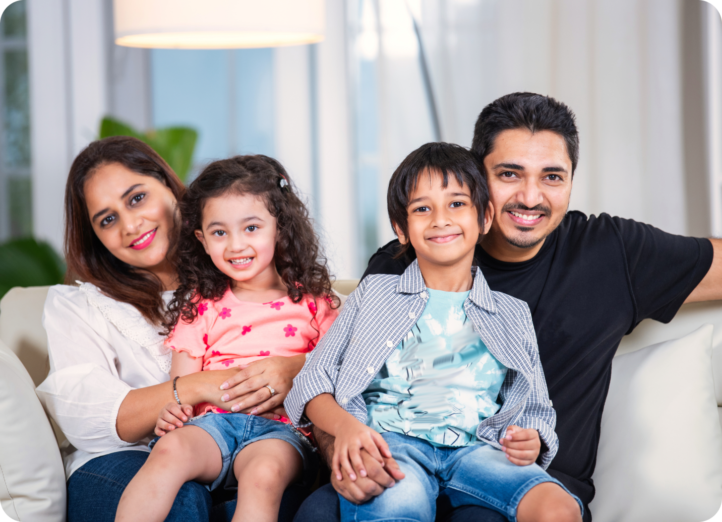 Family sitting on a sofa