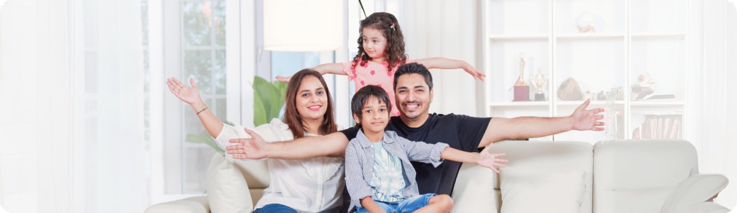 Family sitting on a sofa